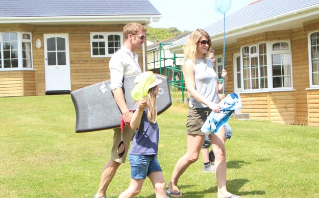 Family enjoying their holiday home outside on the decking